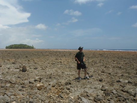 Dick Spink stands on the rocky beach near Barre Island where he believes Amelia Earhart landed her Electra 10E on July 2, 1937. Spinks' compelling discoveries on Mili's Endriken Islands have been met with abject silence by a media that refuses to face the truth in the Earhart disappearance.